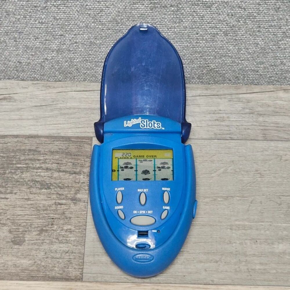Radica Lighted Slots Handheld Game WORKS!